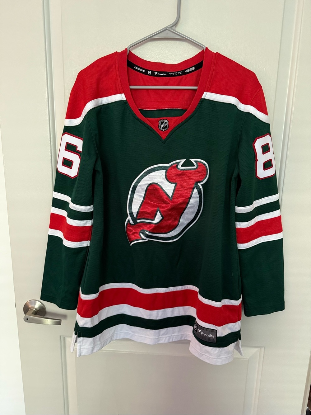 Devils Jack Hughes green reverse retro jersey